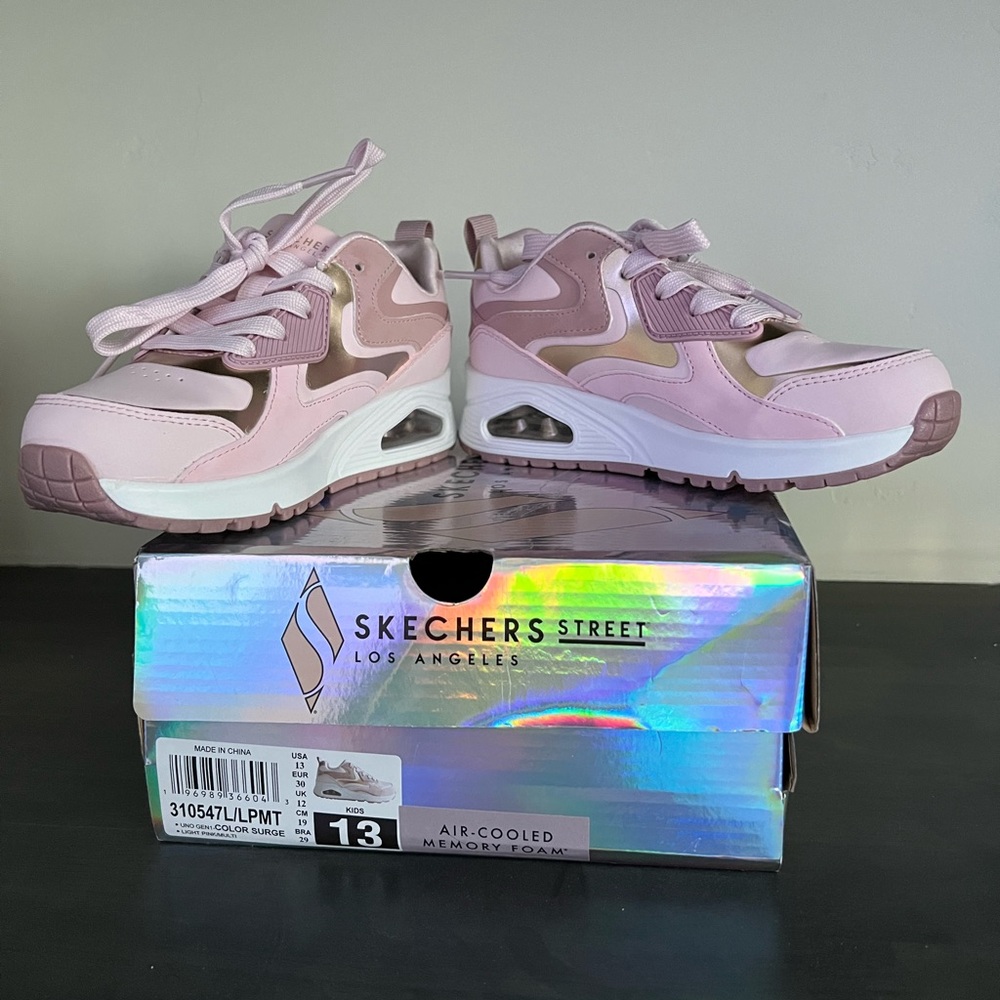 Brand new pair of Skechers sneakers girls size 13.